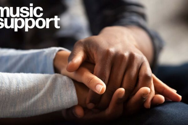 Music support logo with two people holding hands
